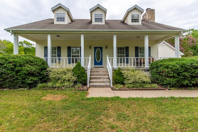 view of front facade with a porch and a front yard