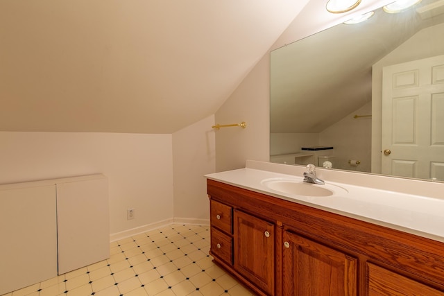 160 Sinking Creek Rd, Petersburg, TN 37144 - bathroom with vaulted ceiling, vanity, tile patterned floors, and baseboards