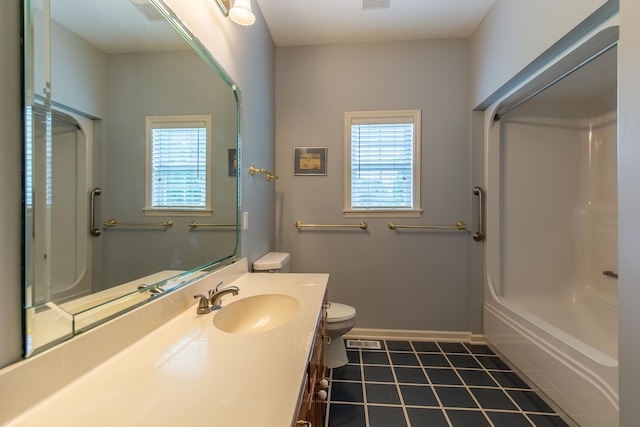 full bathroom featuring tile patterned floors, vanity, shower / washtub combination, and toilet