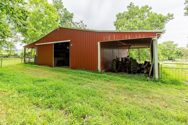 view of outdoor structure featuring a lawn