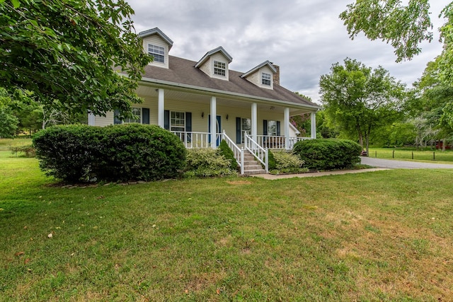 cape cod-style house with a porch and a front lawn