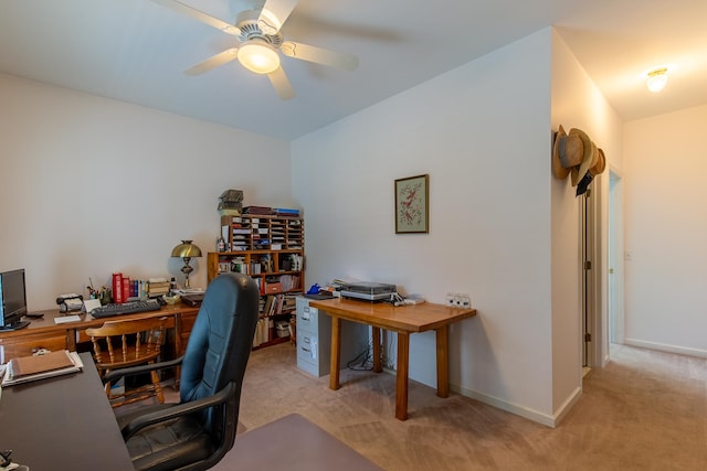 carpeted office featuring ceiling fan