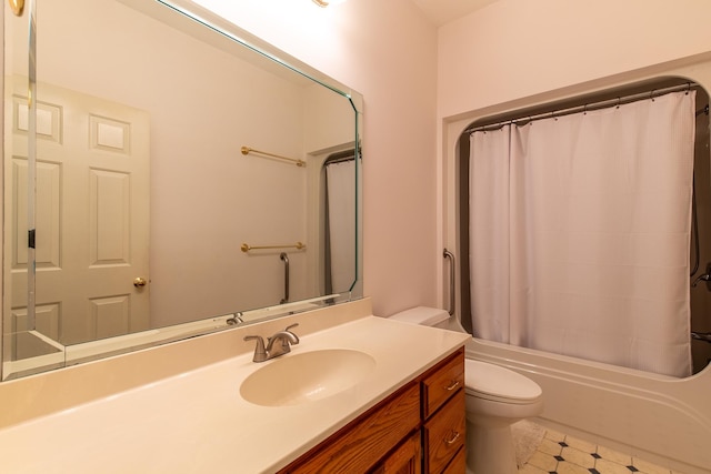 full bathroom featuring tile patterned flooring, shower / bath combo with shower curtain, toilet, and vanity