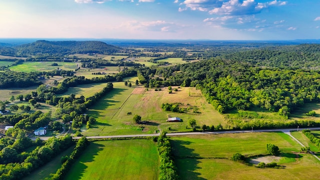 birds eye view of property with a rural view