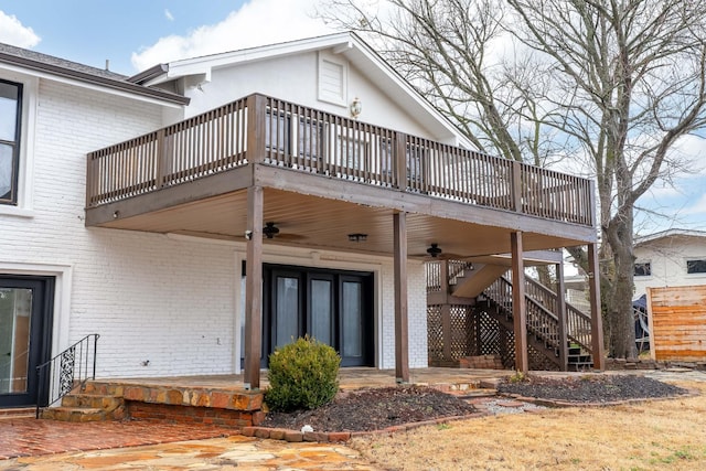 rear view of property with a patio and ceiling fan