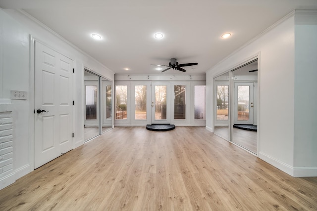 interior space with crown molding, ceiling fan, and light hardwood / wood-style floors