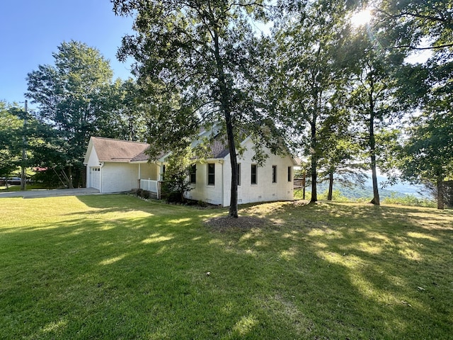 view of yard featuring a garage