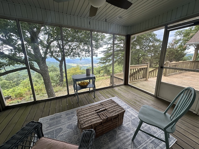 sunroom / solarium with ceiling fan and a wealth of natural light