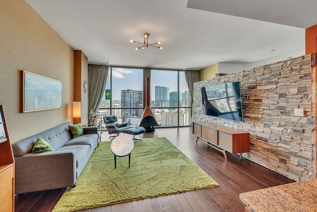 living room featuring dark hardwood / wood-style floors and a notable chandelier