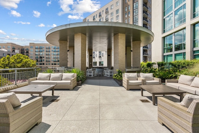 view of patio with a balcony and an outdoor living space