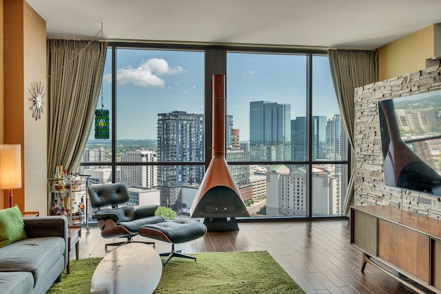 living room with hardwood / wood-style floors and a wall of windows