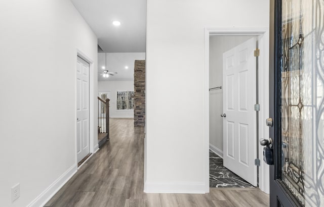 hallway with dark hardwood / wood-style floors