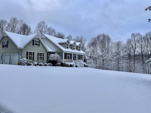 view of front of property with a garage and covered porch