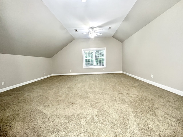 bonus room featuring vaulted ceiling, carpet, and ceiling fan