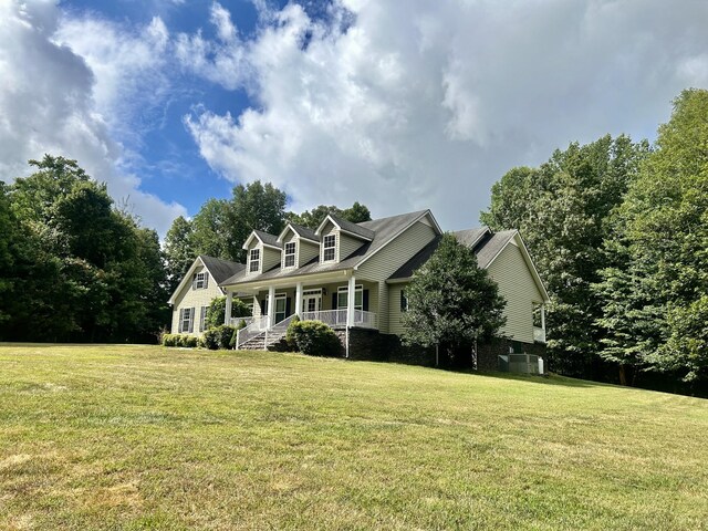 view of front of house featuring a porch and a front yard