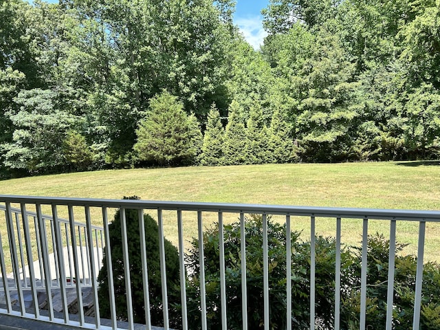 view of yard with a balcony