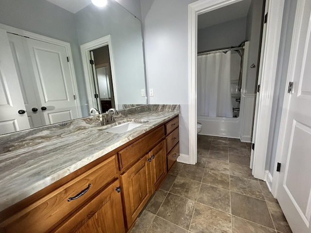 full bathroom with toilet, shower / bath combo with shower curtain, and vanity