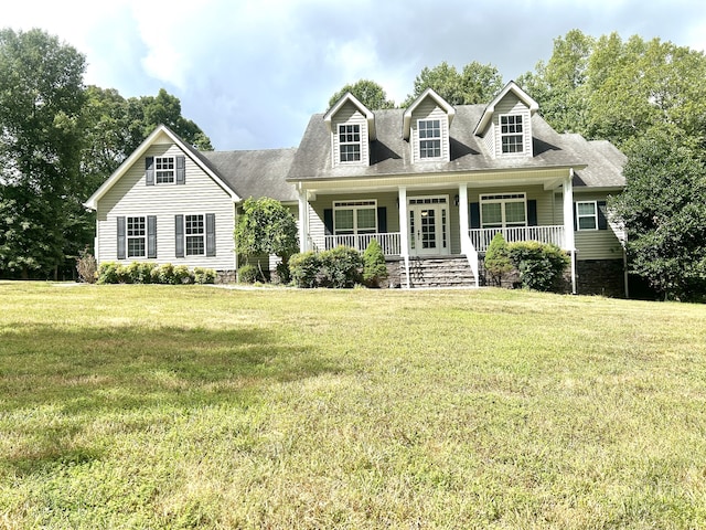 cape cod home featuring a porch and a front yard