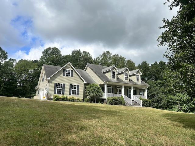 new england style home with covered porch and a front lawn