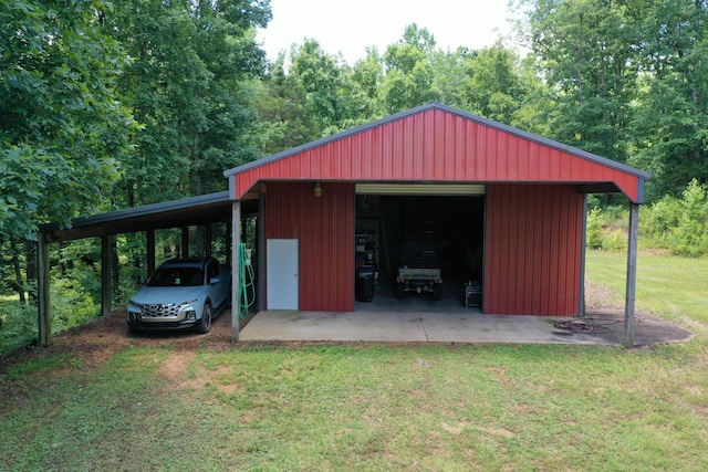 view of outdoor structure with a garage and a yard