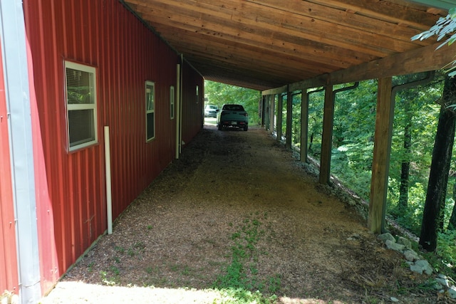 view of side of home with a carport