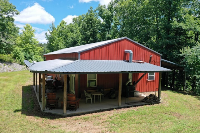 view of outbuilding with a yard