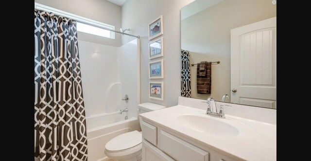 full bathroom with vanity, toilet, and shower / bath combo with shower curtain