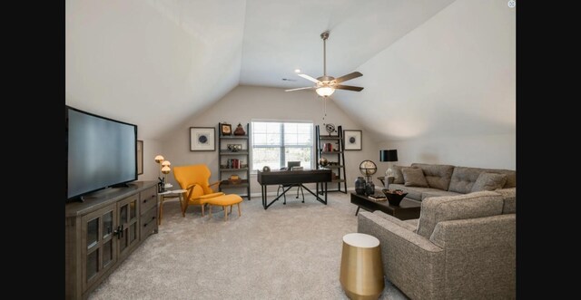 carpeted living room featuring ceiling fan and vaulted ceiling