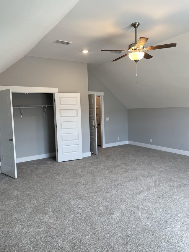 bonus room with lofted ceiling, carpet floors, a closet, and ceiling fan