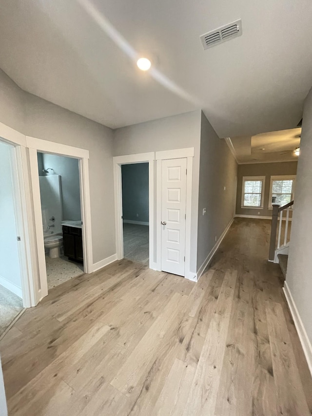 unfurnished room with light wood-type flooring