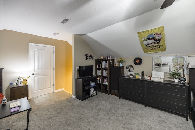 bedroom featuring vaulted ceiling and light colored carpet