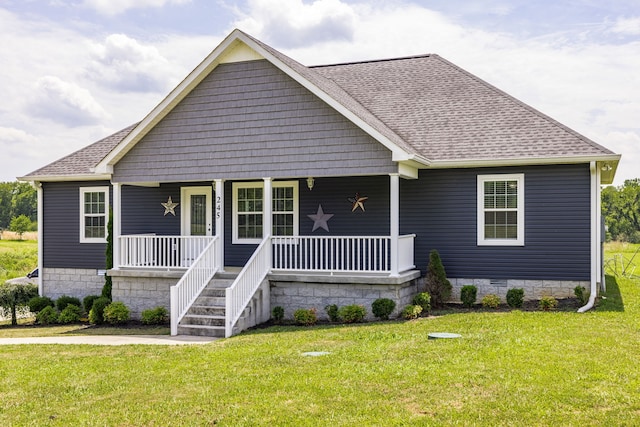 view of front facade with a porch and a front yard