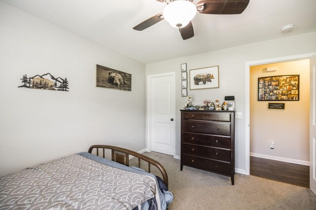 bedroom with ceiling fan and carpet flooring