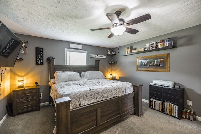 bedroom with carpet, a textured ceiling, and ceiling fan