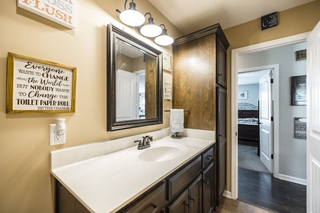 bathroom featuring vanity and wood-type flooring