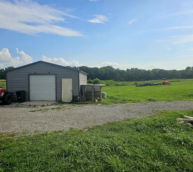 garage with a yard