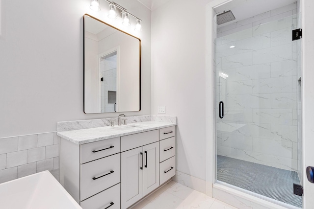 bathroom with an enclosed shower and vanity