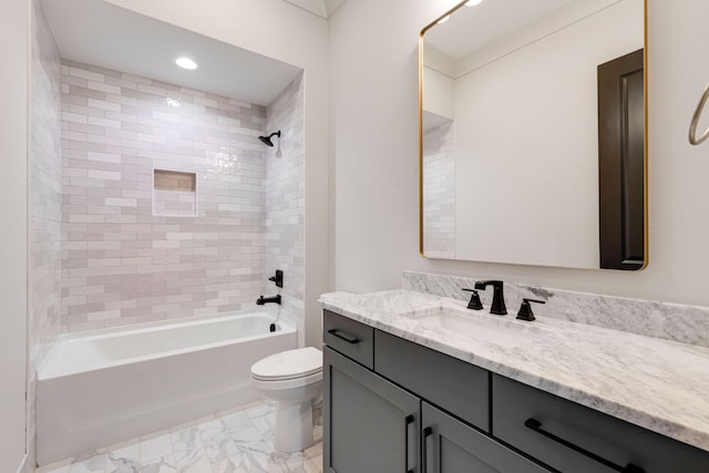 full bathroom with tiled shower / bath, vanity, and toilet