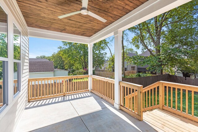 wooden terrace featuring ceiling fan