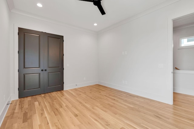 unfurnished room with ornamental molding, light hardwood / wood-style floors, and ceiling fan