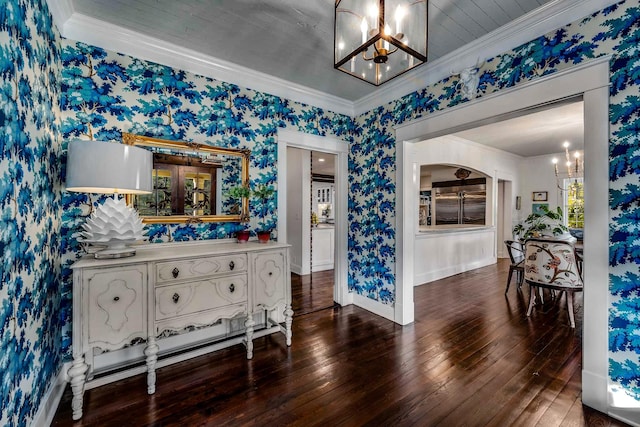 dining space featuring crown molding and a notable chandelier