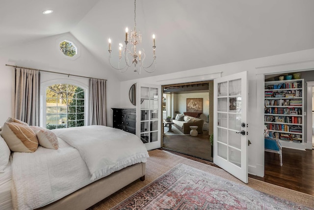 bedroom with lofted ceiling and wood-type flooring