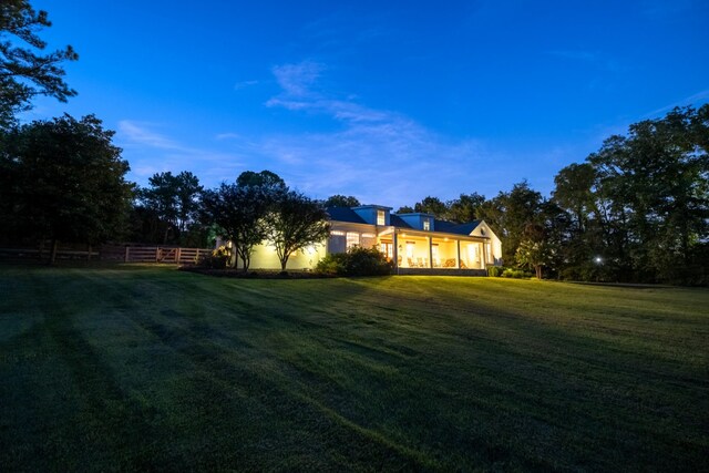 view of yard at dusk