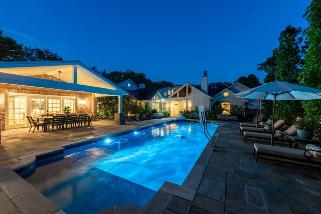 view of swimming pool with a patio