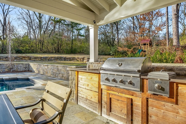 view of patio with area for grilling and grilling area