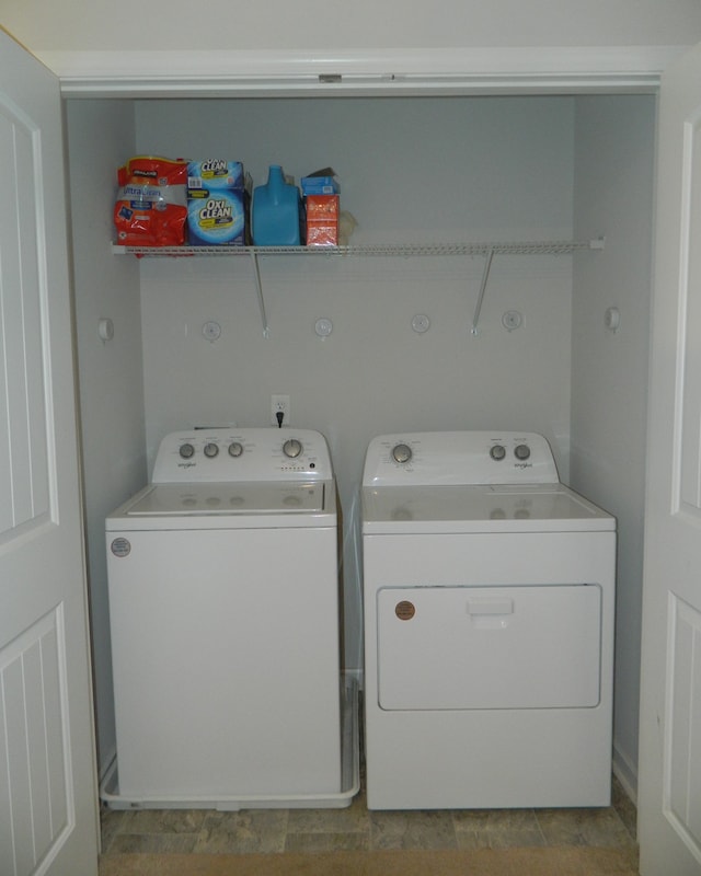 washroom with independent washer and dryer