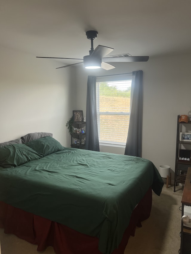 carpeted bedroom with ceiling fan