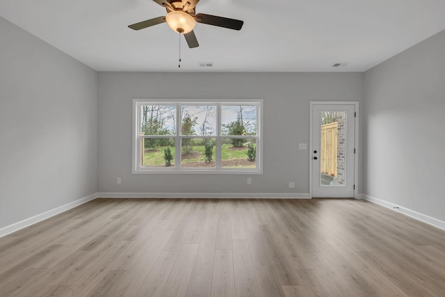 unfurnished living room with ceiling fan and light wood-type flooring