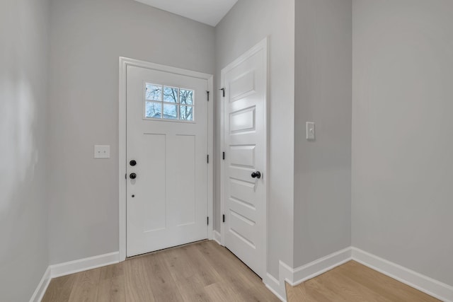 entrance foyer with light hardwood / wood-style flooring