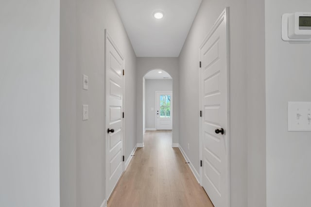 hallway with light hardwood / wood-style flooring